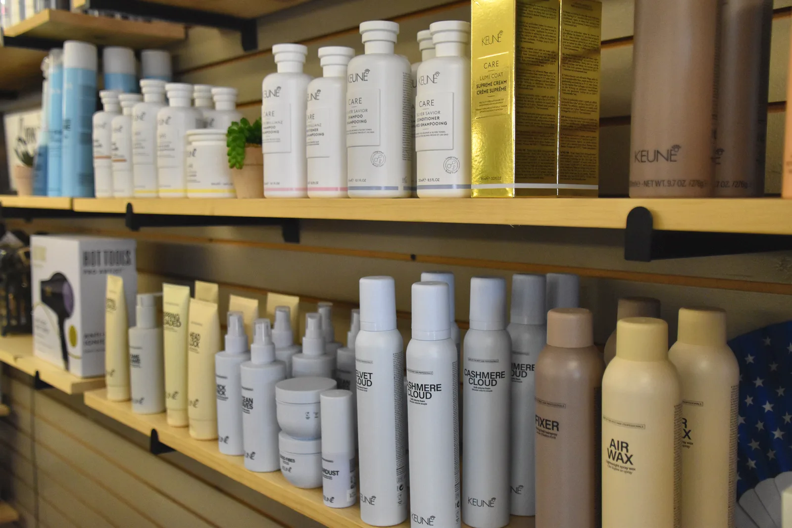 Professional hair products on the shelf at KC Clippers Salon